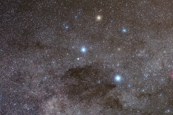 Just as if they had been dotted on top of the myriads of glowing suns in the Milky Way, this image depicts some of the brightest stars of the southern sky: on the right, in a rhomboidal shape reminding that of a kite, are the four stars of the constellation Crux, the Southern cross; in the lower left part, instead, shine the two most brilliant stars of the constellation Centaurus, the Centaur.